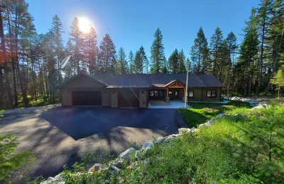 Custom home in the pines with a paved drive, Flathead Valley, Montana