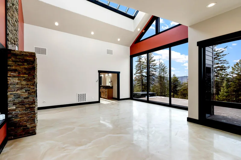 Huge skylight over epoxy floors in a mountain modern great room