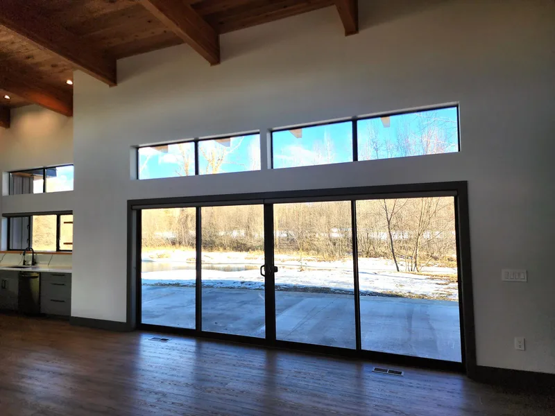 Window wall with a view of the river, River Frontage Montana Style