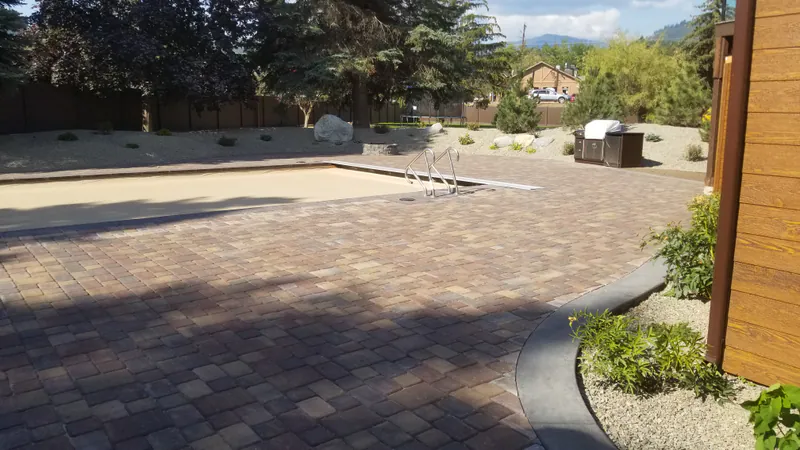 Barbeque by the pool, Flathead Lake Luxury Remodel by Built Right in Montana