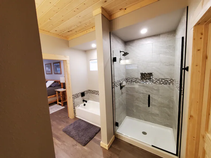 Custom tile borders Montana flair, Glacier Park Retreat by Built Right in Montana