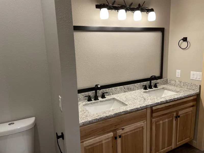 Hickory vanity, granite and undermount sink, Glacier Park Retreat by Built Right in Montana