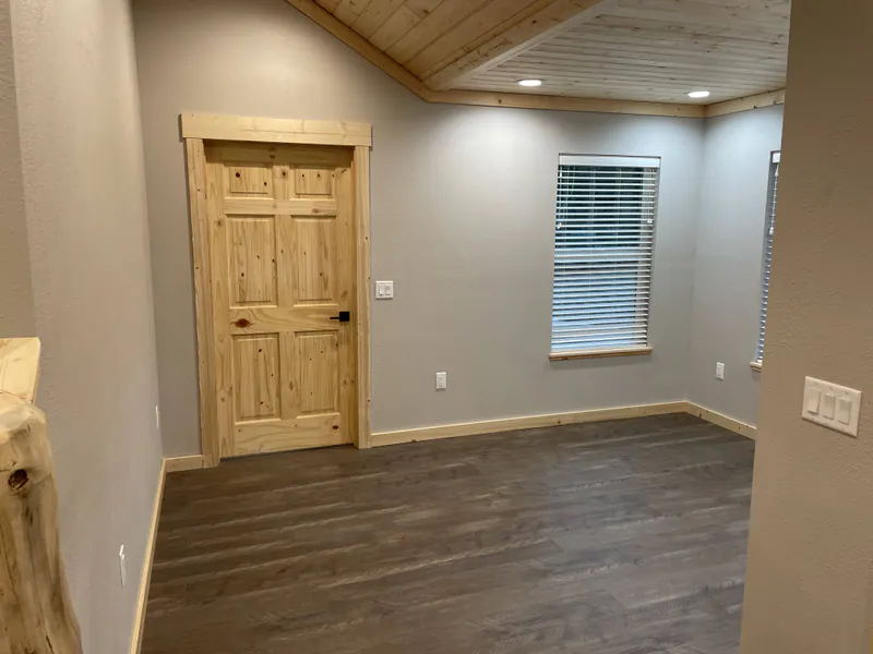 Lvp flooring and wood ceilings, Glacier Park Retreat by Built Right in Montana