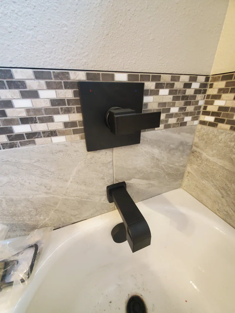 Moen fixtures and custom tile, Glacier Park Retreat by Built Right in Montana