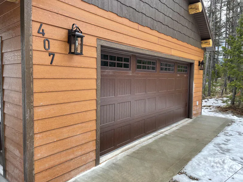 Overhead custom doors and log accents, Glacier Park Retreat by Built Right in Montana