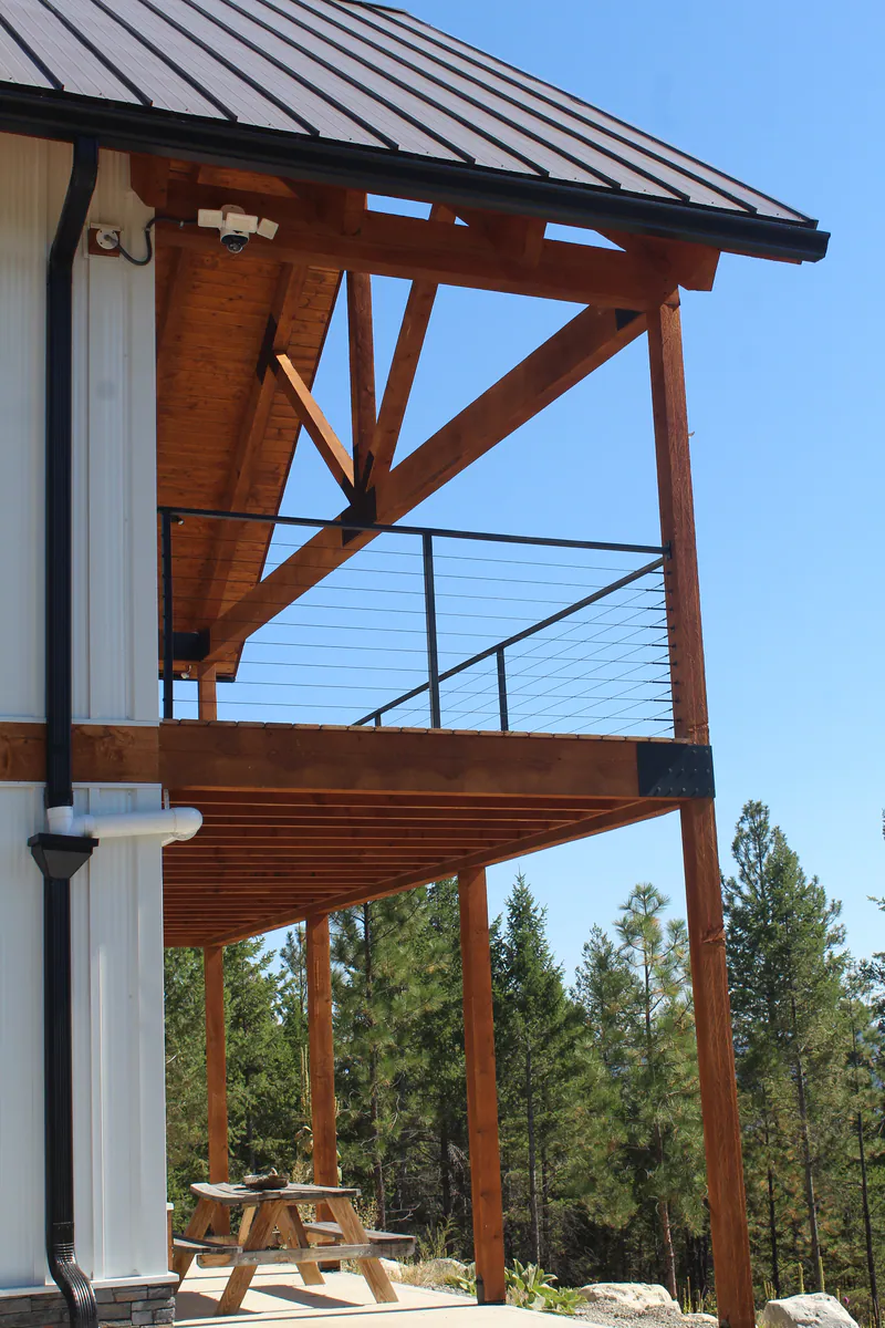 A timber-frame deck on a Built Right home above the Flathead Valley