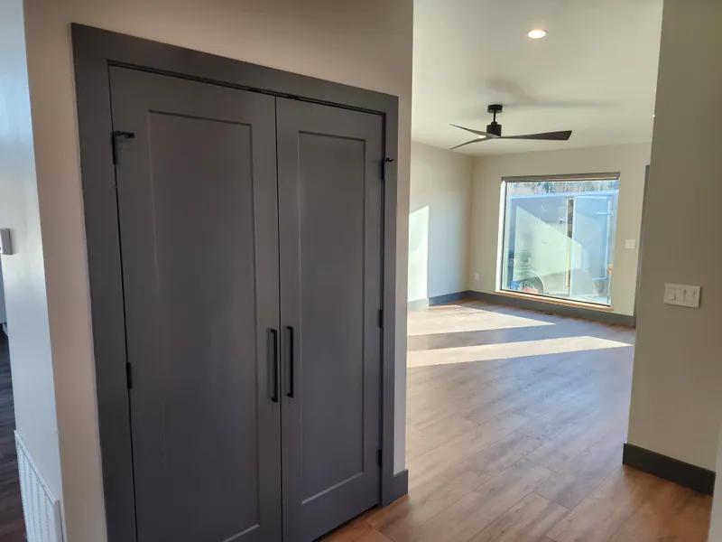 Solid core interior doors in Sherwin Williams Peppercorn, River Frontage Montana Style by Built Right in Montana