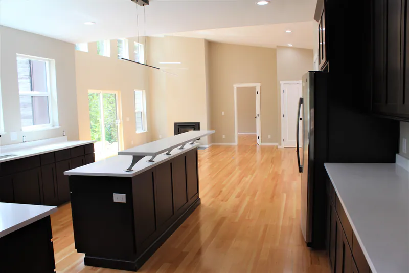 Custom kitchen island: Huntwood cabinets, Secluded Flathead Montana Luxury by Built Right in Montana