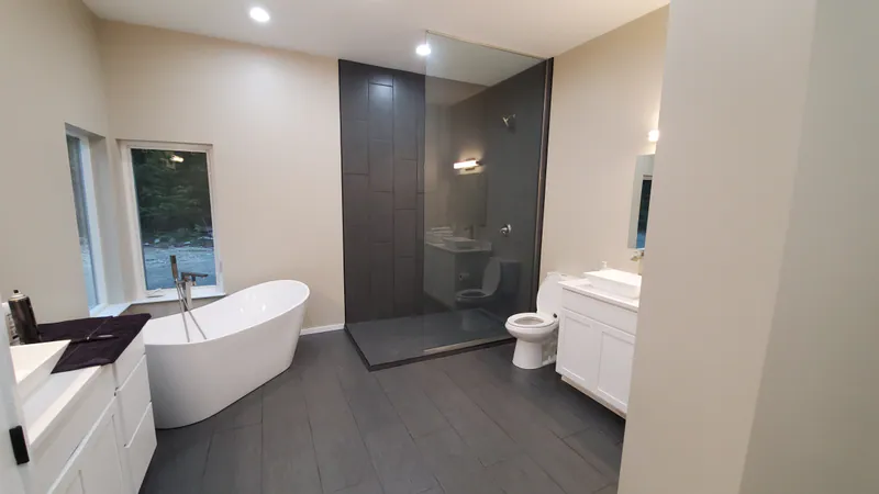 Slipper tub and open ended shower, Secluded Flathead Montana Luxury by Built Right in Montana