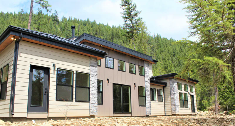 Stone accents and variable siding styles, Secluded Flathead Montana Luxury by Built Right in Montana