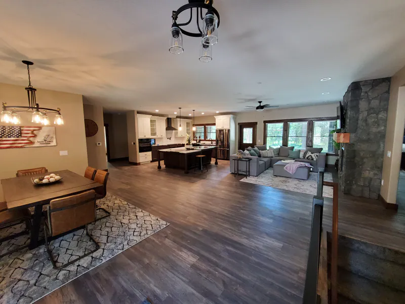 Kitchen and dining, open to the living room, the Reese family home by Built Right in Montana