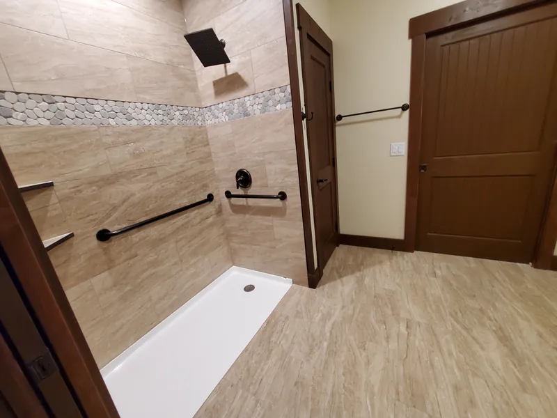A roll-in shower, the Reese family home by Built Right in Montana