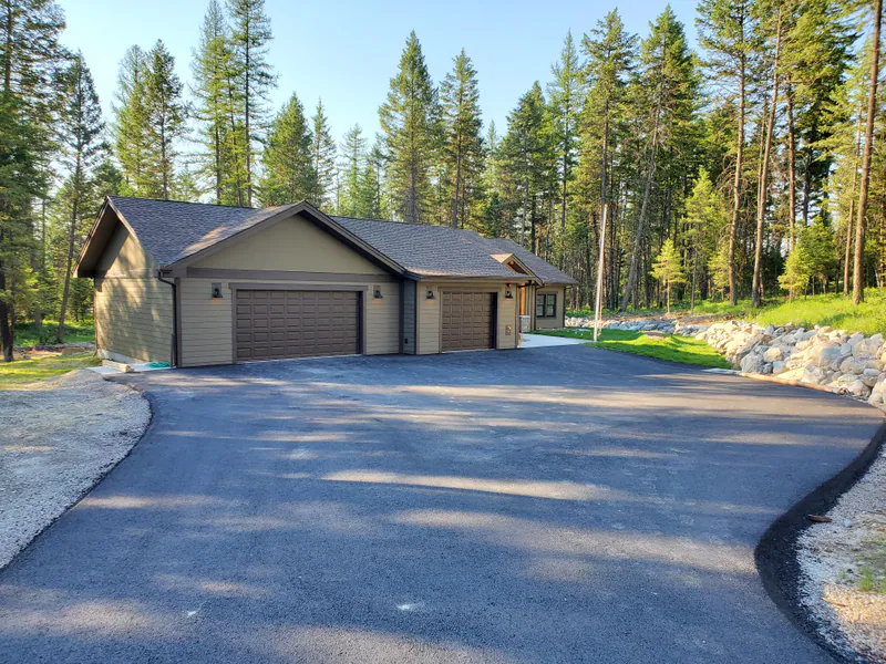 The garage and the new drive, the Reese family home by Built Right in Montana